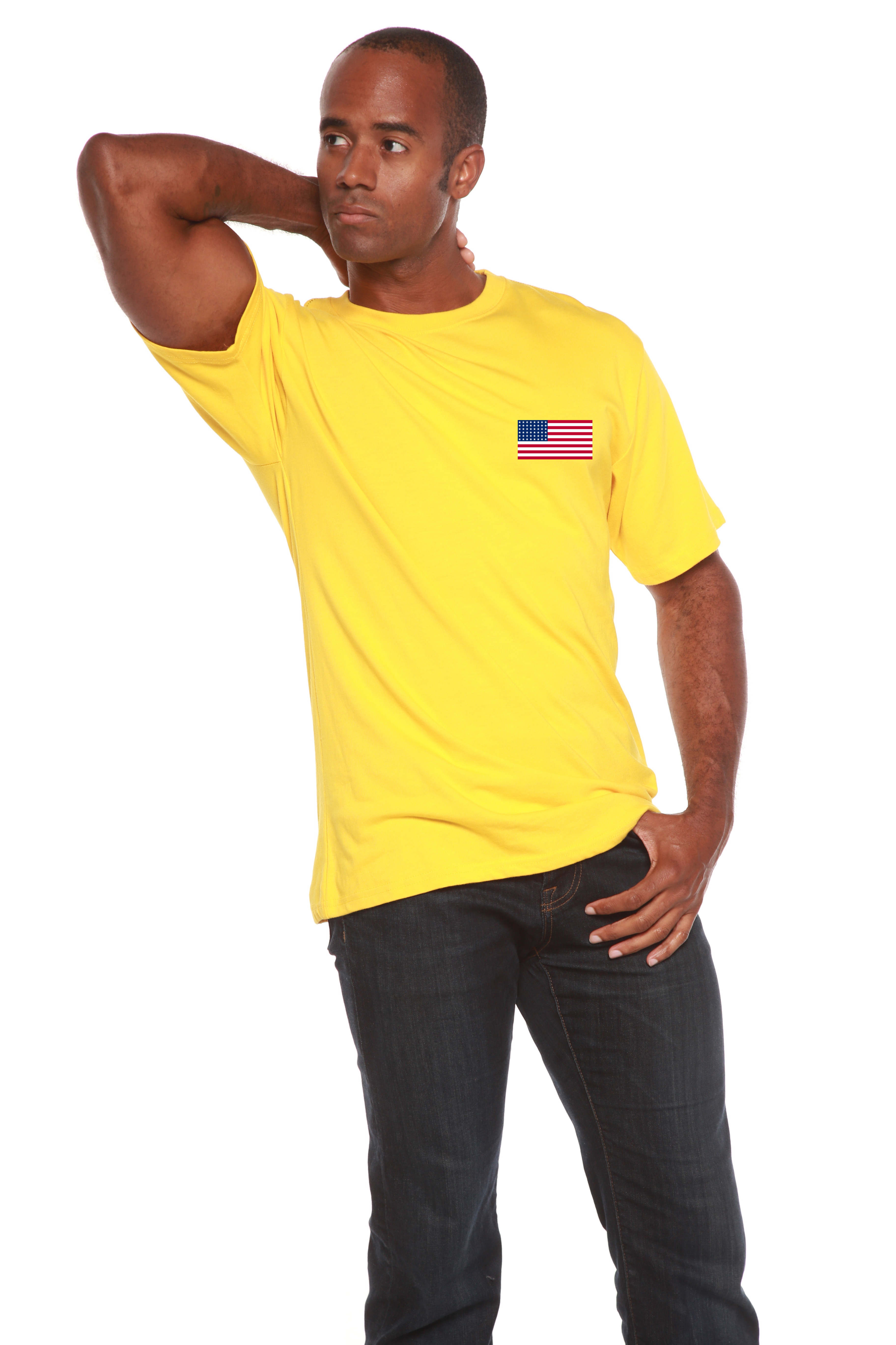 Man wearing a yellow t-shirt and dark jeans on a white background