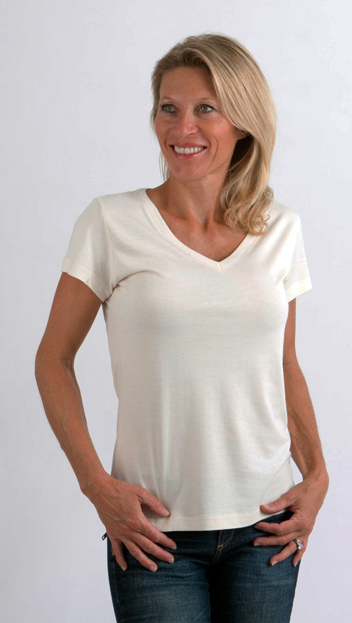 Woman wearing a plain white t-shirt against a white background