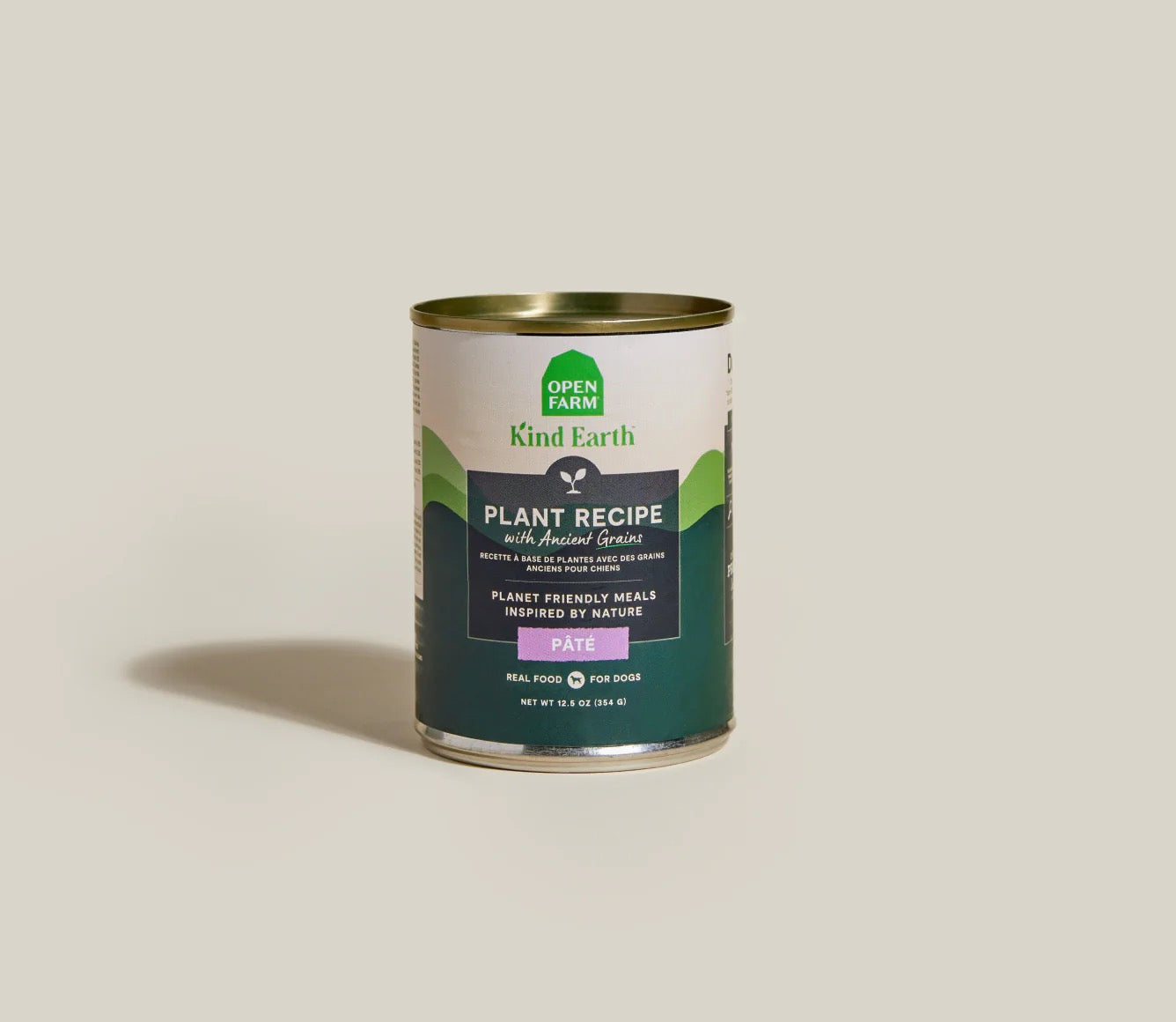 Can of Kind Earth plant recipe pet food on a beige background