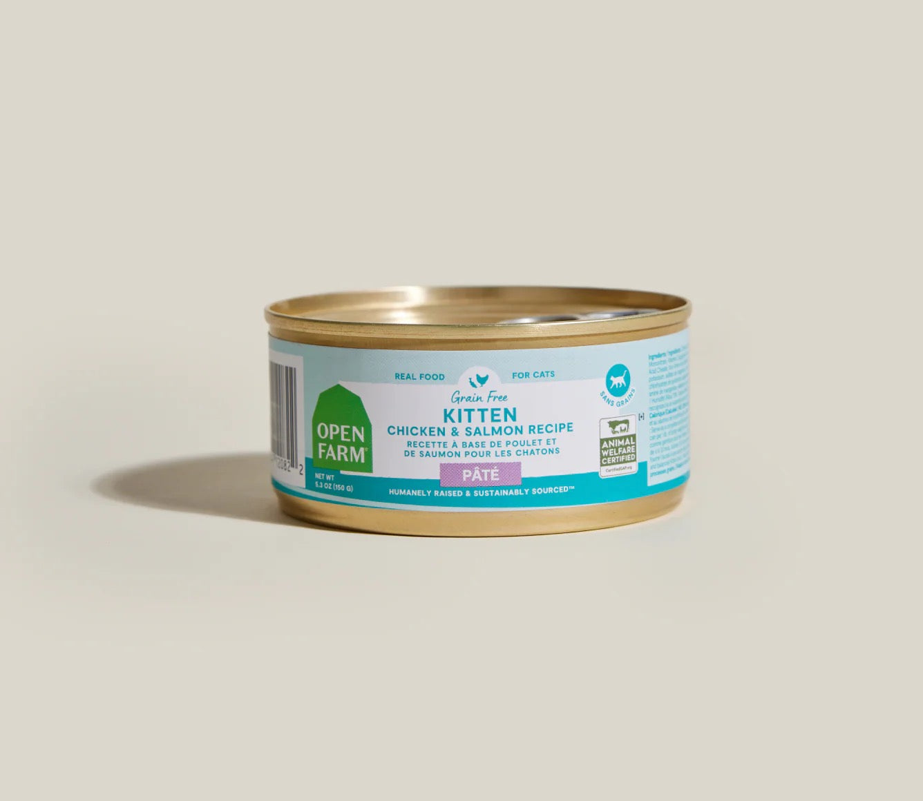 Can of Open Farm kitten food with chicken and salmon recipe on a beige background