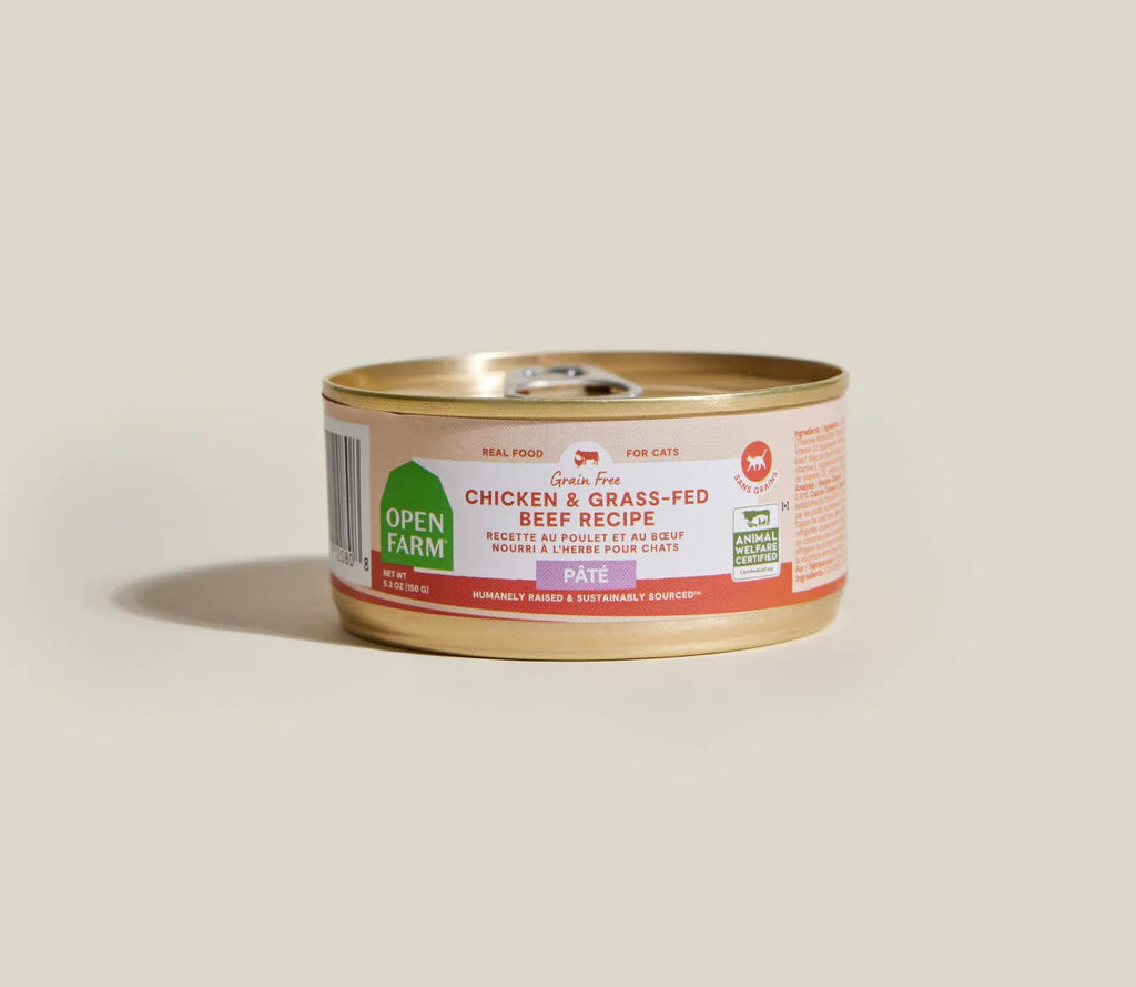 Can of Open Farm cat food on a beige background