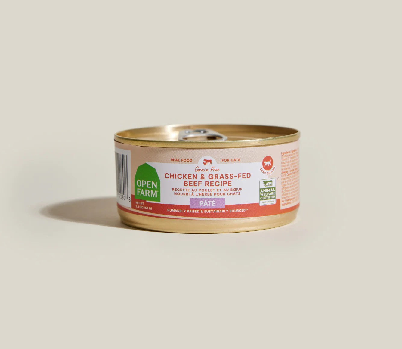 Can of Open Farm cat food on a beige background