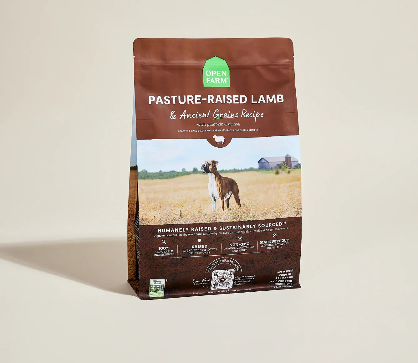 Bag of Open Farm pasture-raised lamb and ancient grains dog food on a beige background