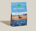 Open Farm small breed dog food package on a beige background