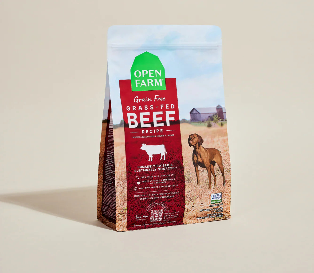 Open Farm grain-free grass-fed beef recipe dog food package on a beige background