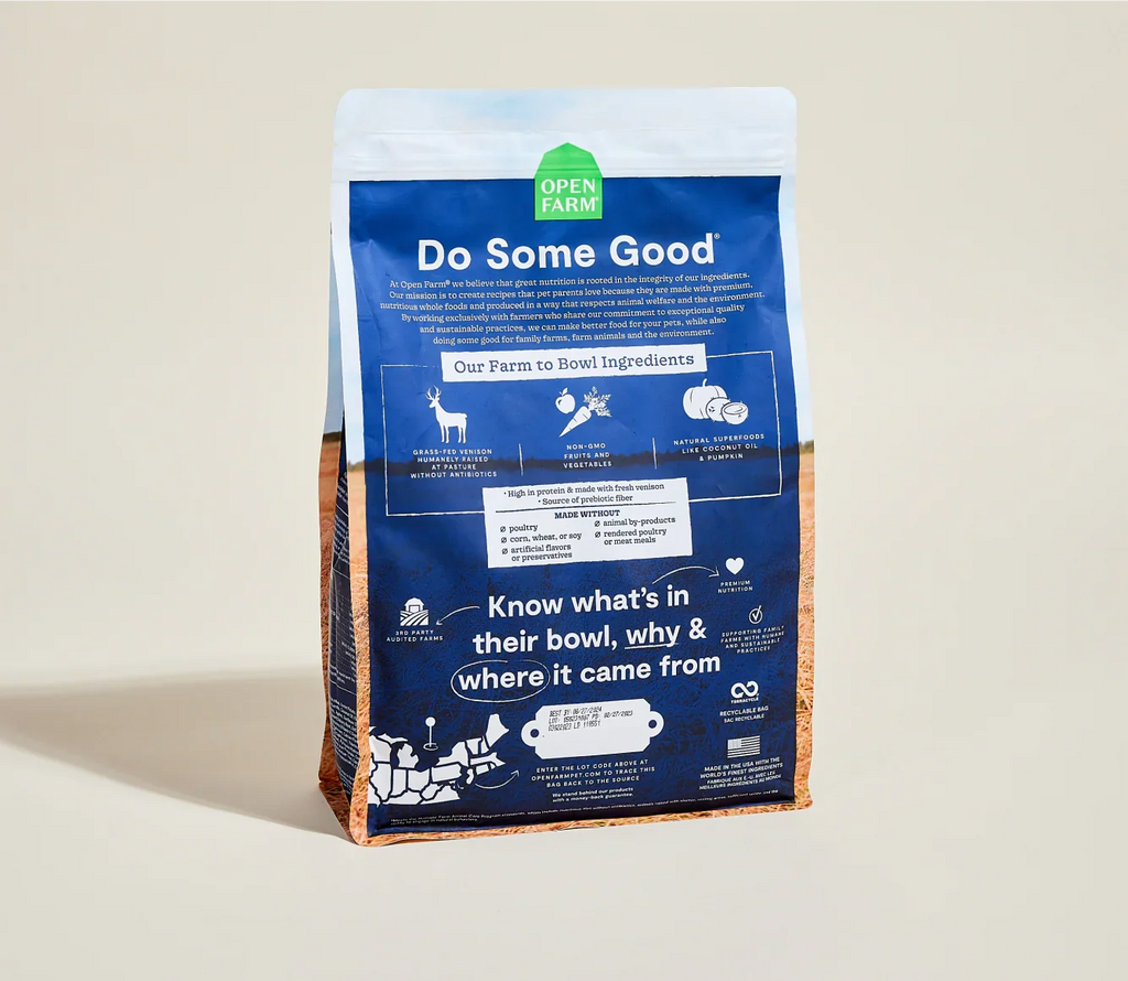 Open Farm pet food bag with blue label on a beige background