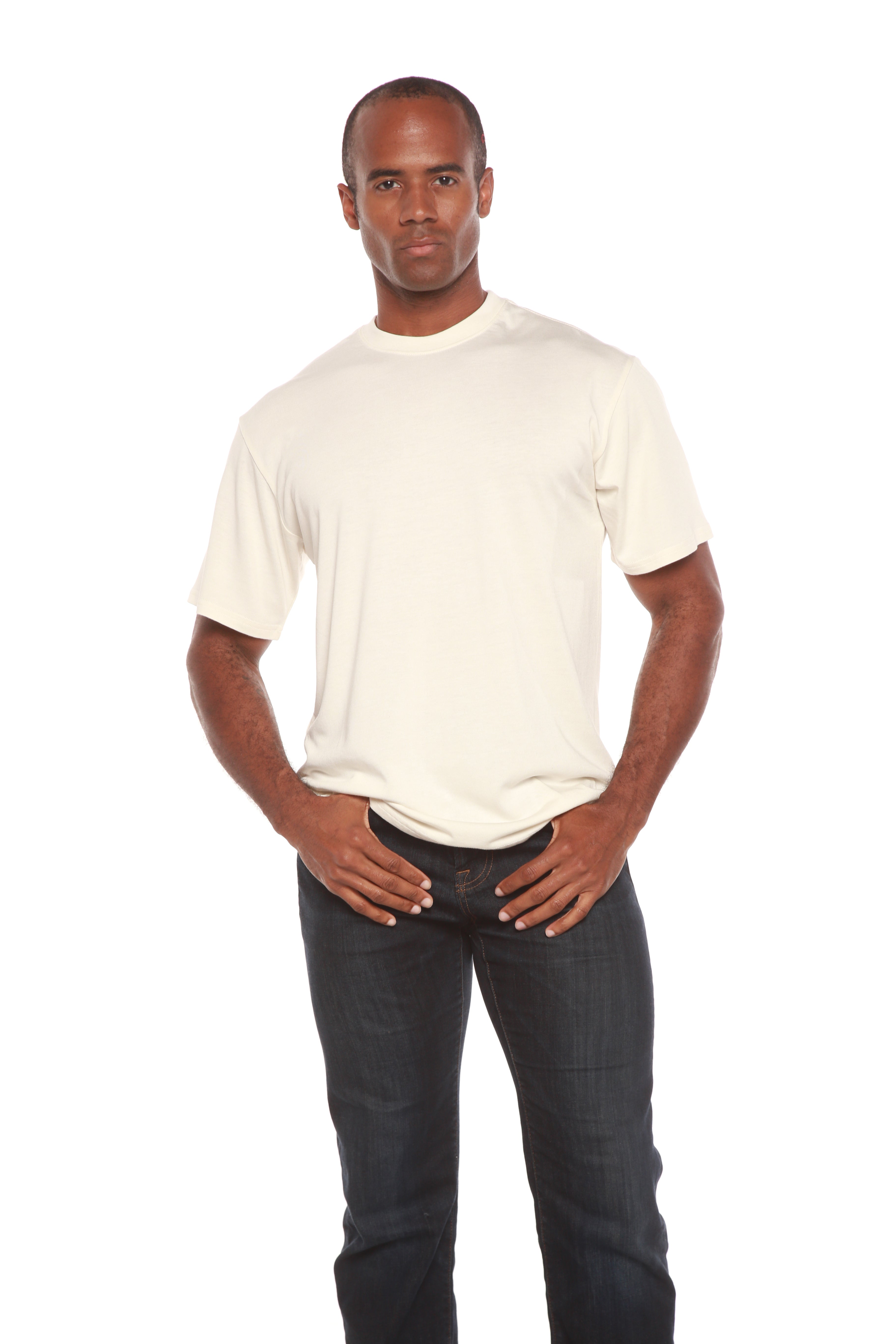 Man wearing a plain white t-shirt and dark jeans on a white background