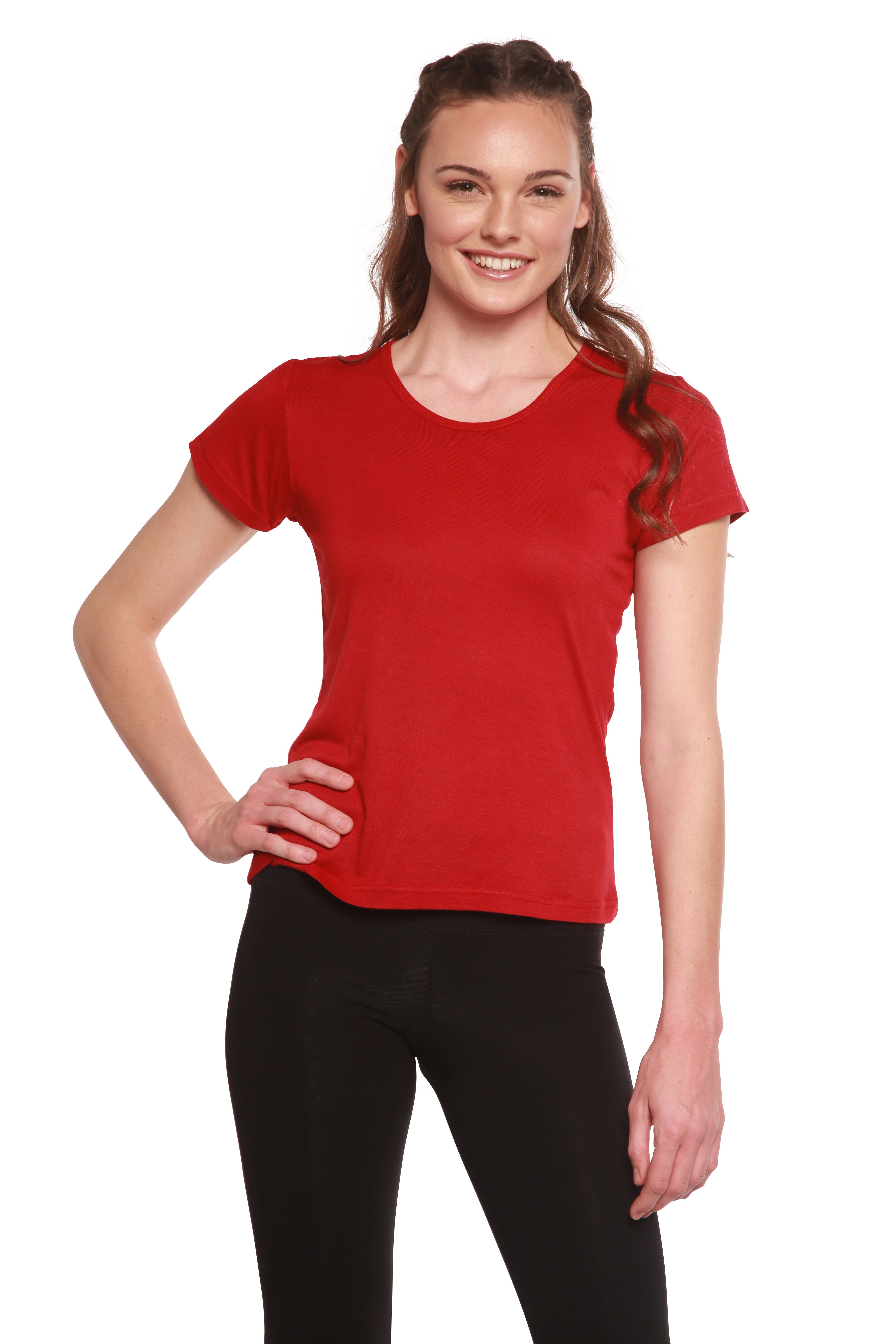 Woman wearing a red t-shirt and black leggings on a white background