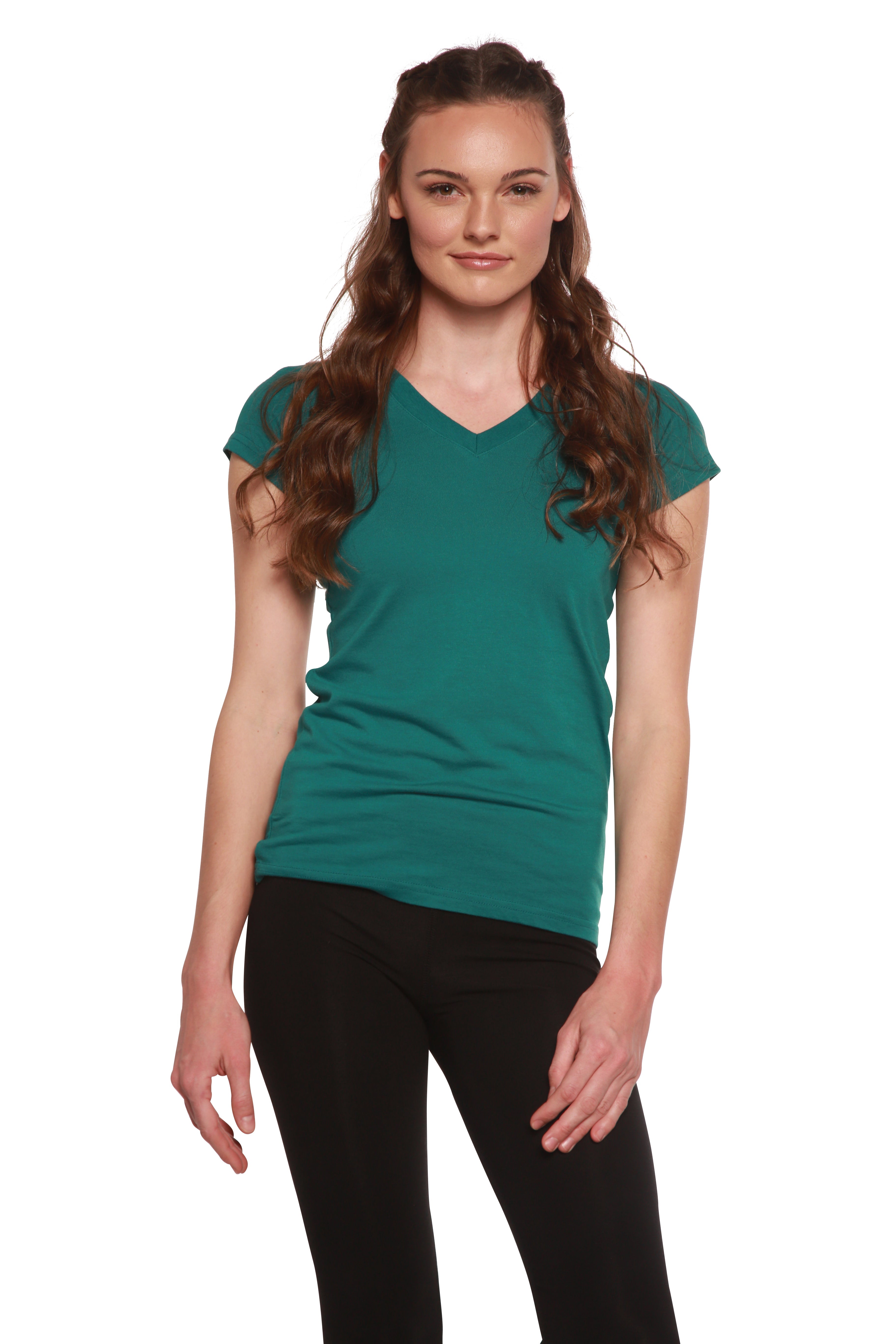 Woman wearing a teal t-shirt and black pants on a white background