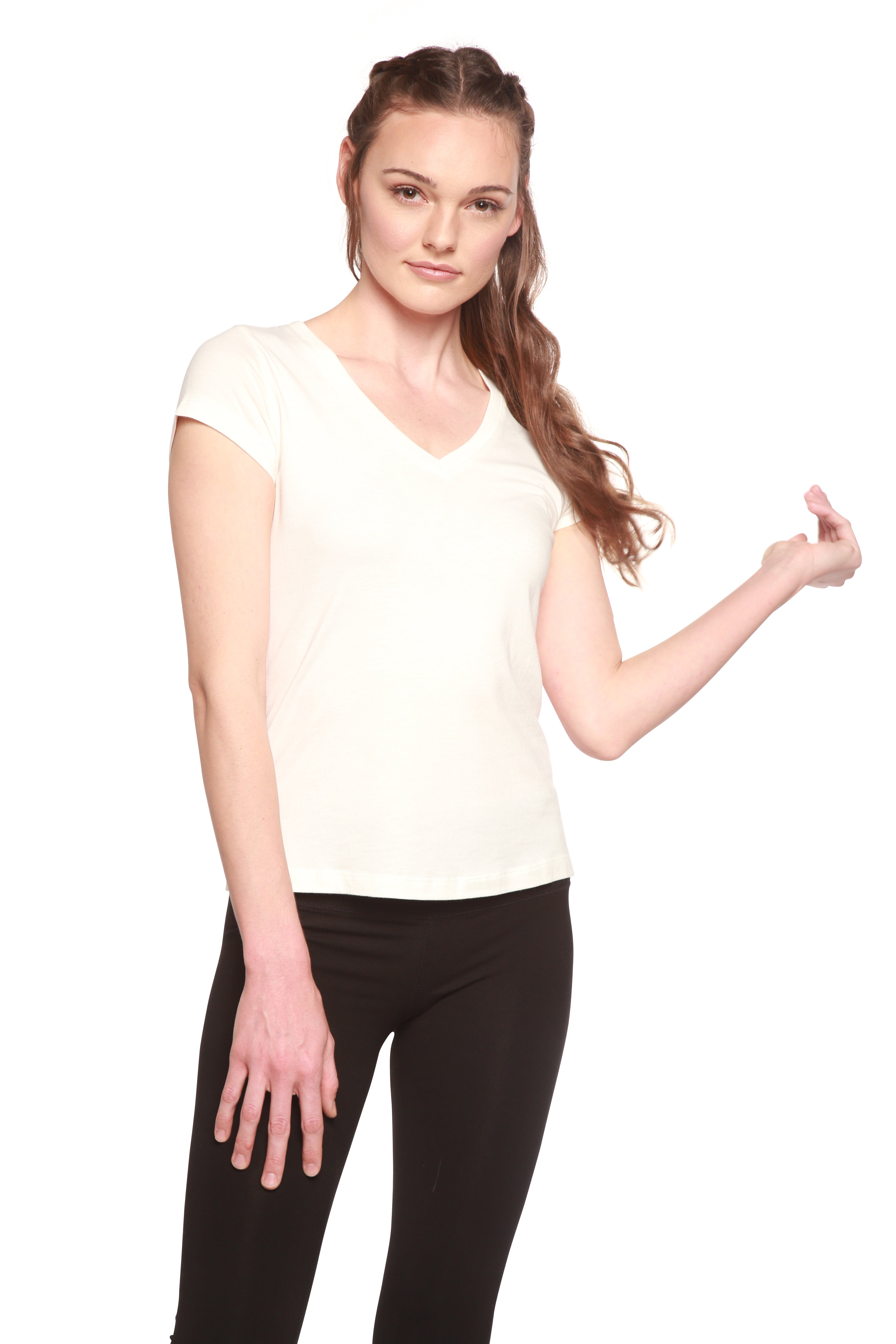 Woman wearing a white top and black pants on a white background